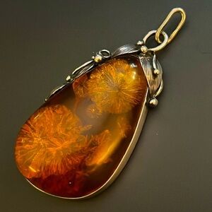 Vintage Amber peach-shaped pendant with sterling setting